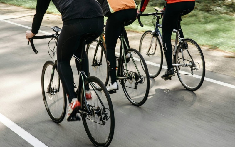 a group of people riding bikes